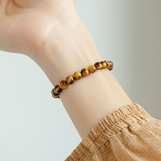 Natural yellow tiger's eye bracelet featuring elegant design, perfect for stylish jewelry collections.